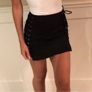 by the way. Black grommet detail skirt